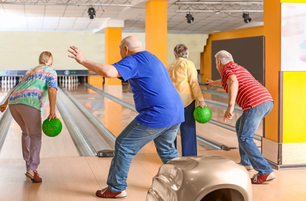 seniors playing bowling together