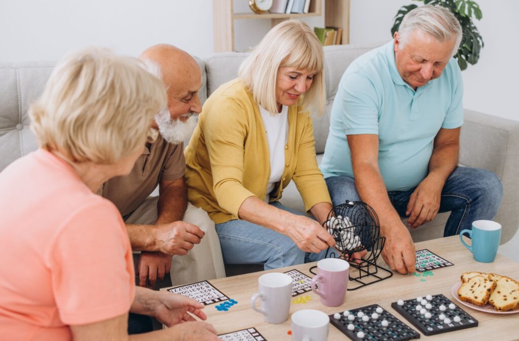 A group of older adults play bingo together.